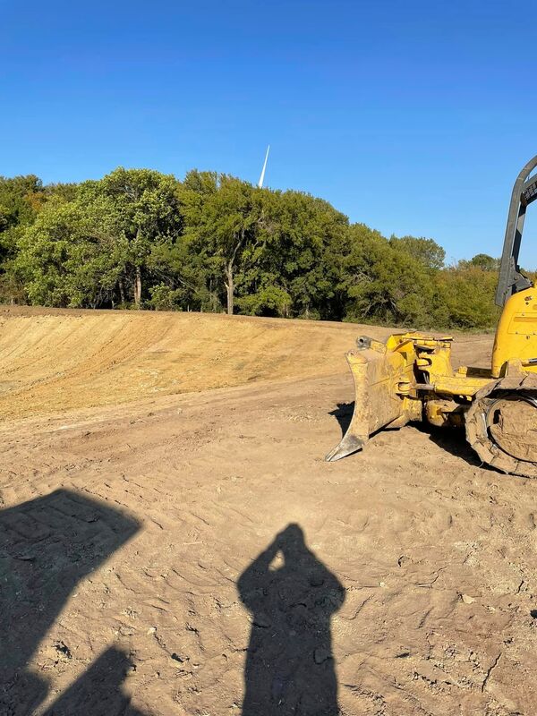 Bulldozer grading land for site preparation project