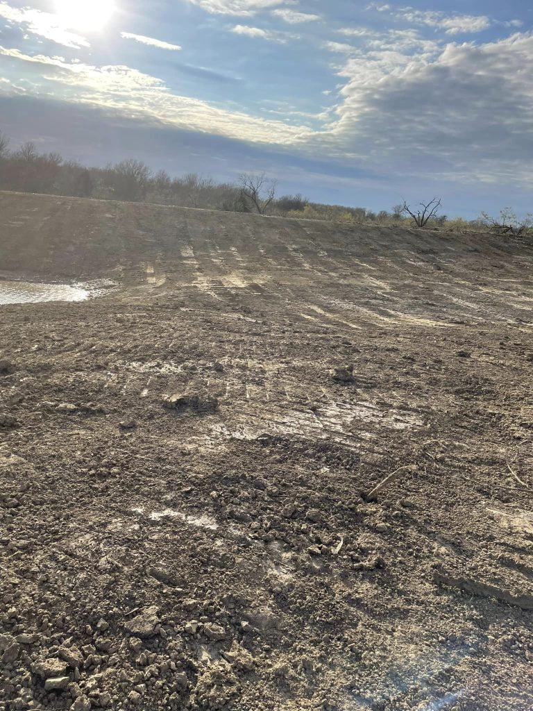 Graded land prepared for construction or site development